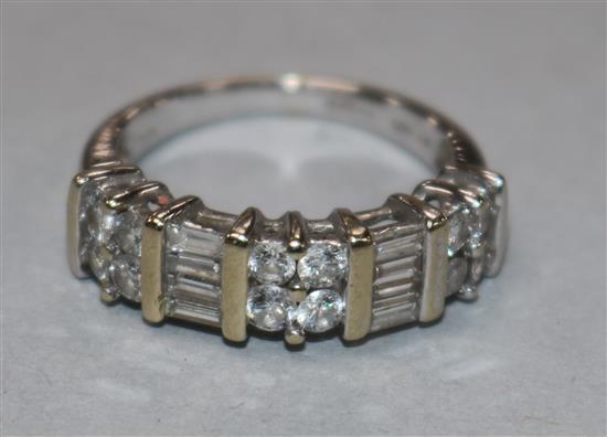 An 18ct white gold and diamond half hoop ring set with five cluster of round or baguette cut stones, size M.
